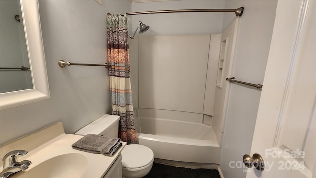 full bathroom featuring shower / bath combination with curtain, toilet, and oversized vanity