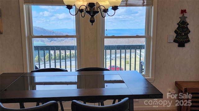 301 Pinnacle Inn Rd Unit 2306, Beech Mountain, NC 28604 - dining space featuring a mountain view, a chandelier, and a textured wall