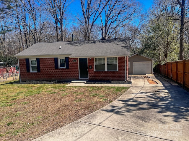 single story home featuring a front yard and a garage