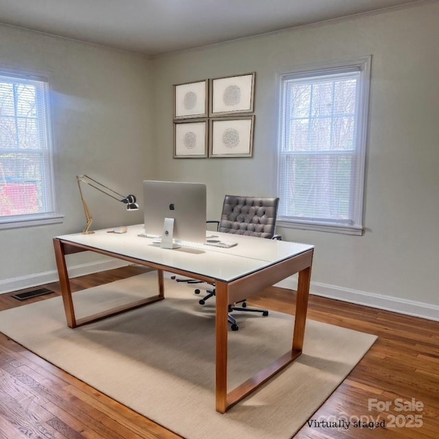 home office featuring wood-type flooring and plenty of natural light