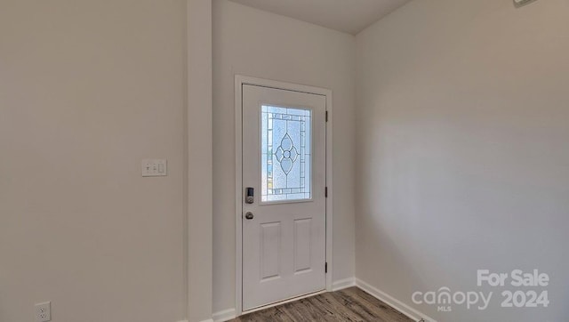 doorway featuring dark hardwood / wood-style floors