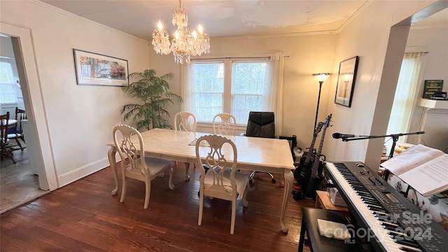 dining room with an inviting chandelier, dark hardwood / wood-style floors, and ornamental molding