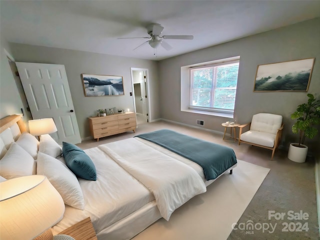 carpeted bedroom featuring ceiling fan