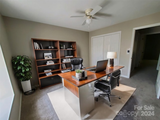 office area with ceiling fan and concrete floors