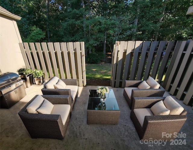 view of patio with an outdoor living space, area for grilling, and grilling area