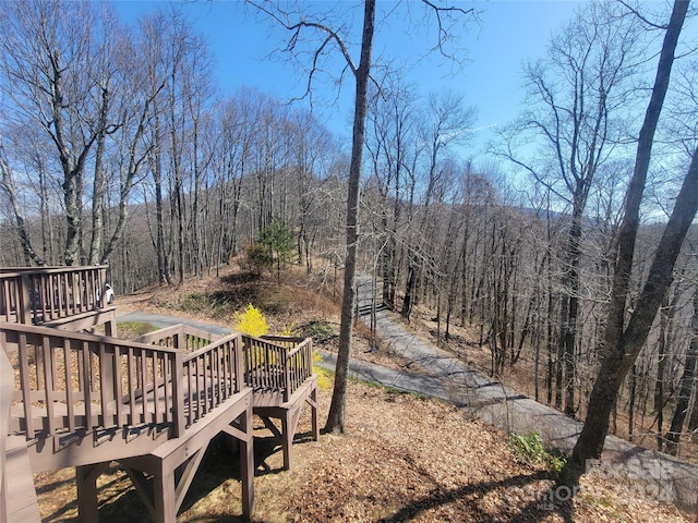 view of yard featuring a wooden deck