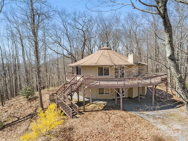 view of front of home with a deck and a patio