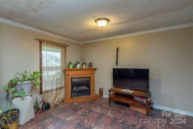 living room featuring dark tile floors, a textured ceiling, and crown molding