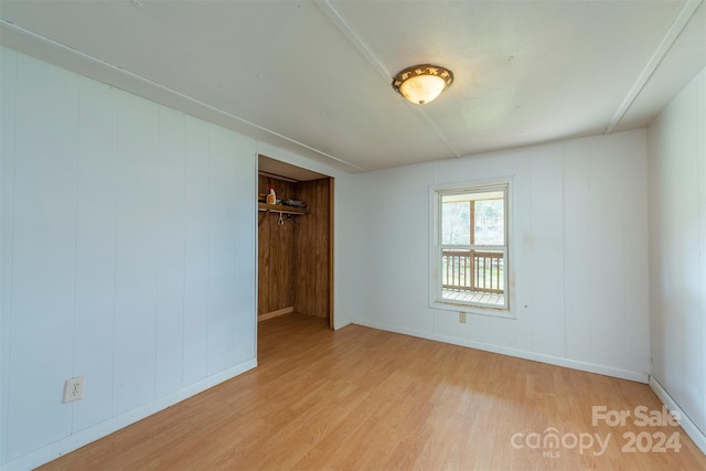 unfurnished room with light hardwood / wood-style floors