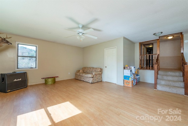 unfurnished room featuring ceiling fan, light hardwood / wood-style flooring, a textured ceiling, and crown molding