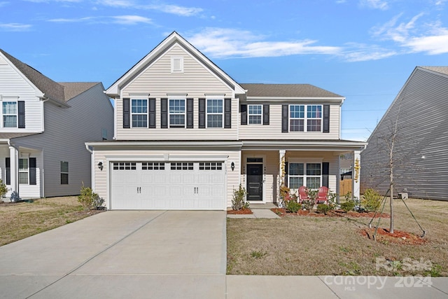 view of front facade with a front yard and a garage