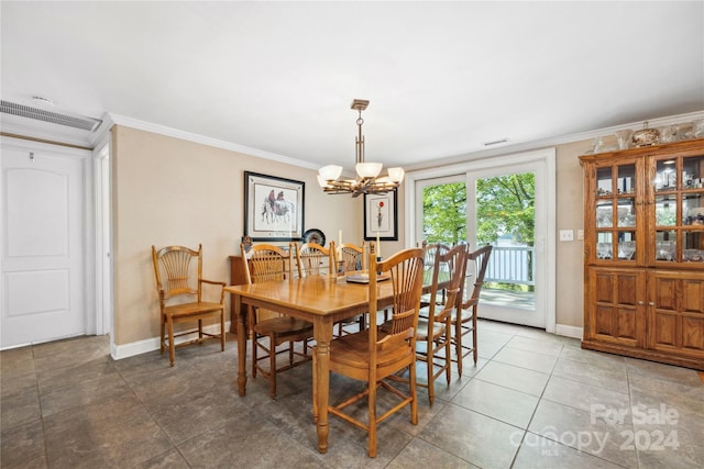 tiled dining room featuring crown molding and a notable chandelier