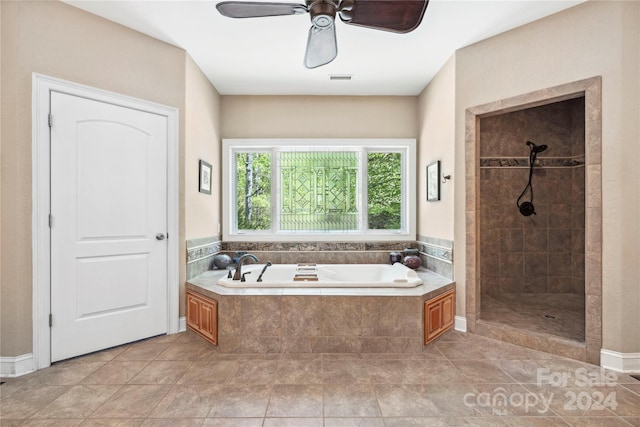 bathroom featuring ceiling fan, shower with separate bathtub, and tile floors