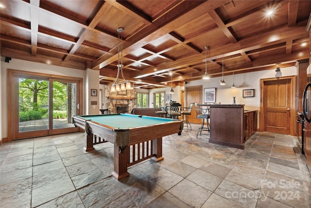 recreation room with coffered ceiling, beam ceiling, a fireplace, and billiards