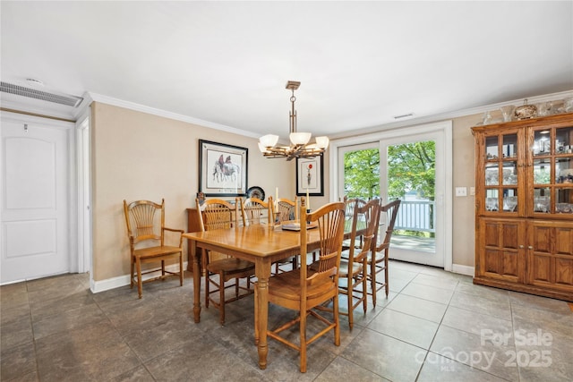 dining space featuring a chandelier, baseboards, visible vents, and crown molding