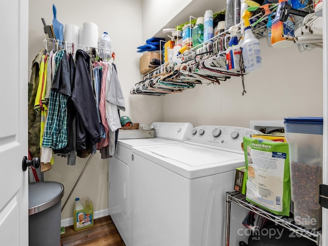 washroom featuring separate washer and dryer and dark hardwood / wood-style flooring