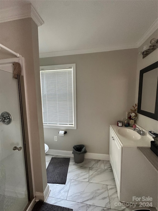 bathroom featuring a shower with door, crown molding, toilet, vanity, and tile patterned floors