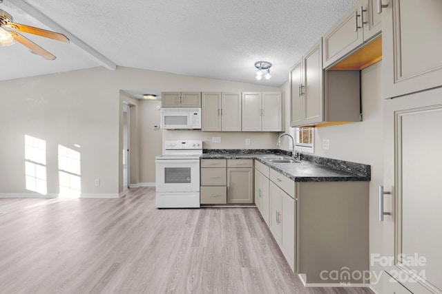 kitchen with sink, white appliances, vaulted ceiling with beams, and a textured ceiling