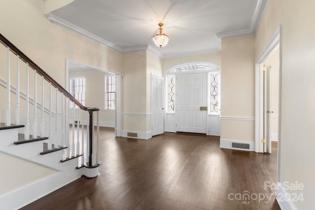 entryway featuring dark wood-type flooring and crown molding