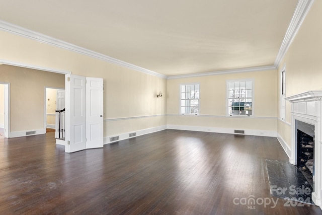 unfurnished living room with dark hardwood / wood-style floors, a fireplace, and crown molding