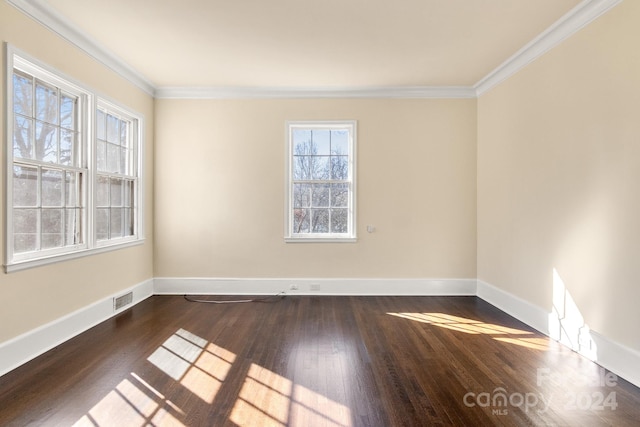 unfurnished room featuring crown molding and hardwood / wood-style floors