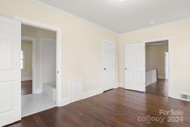 unfurnished bedroom featuring ornamental molding and dark hardwood / wood-style flooring