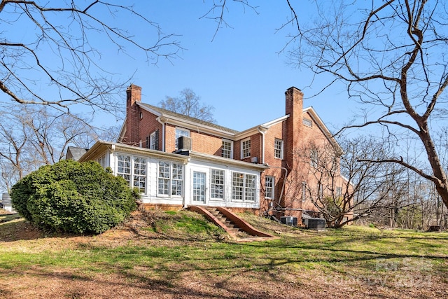 back of property featuring central AC unit