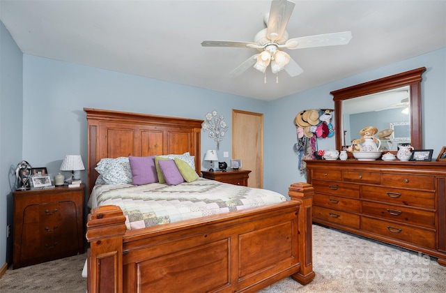 bedroom featuring light colored carpet and ceiling fan