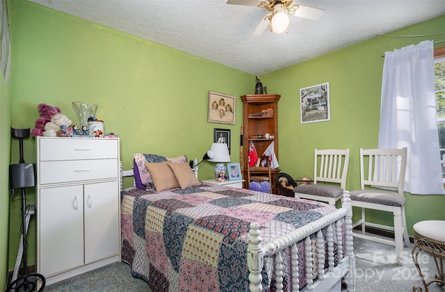 bedroom with ceiling fan, light colored carpet, and a textured ceiling