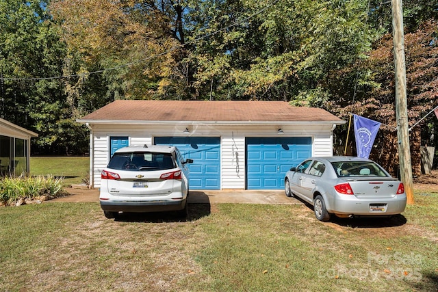 garage with a yard