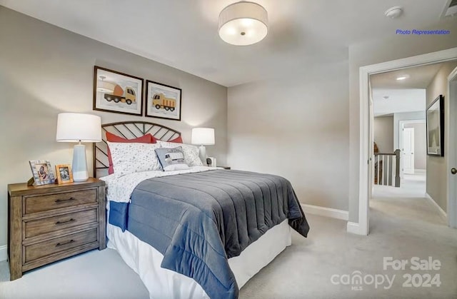 bedroom featuring light carpet