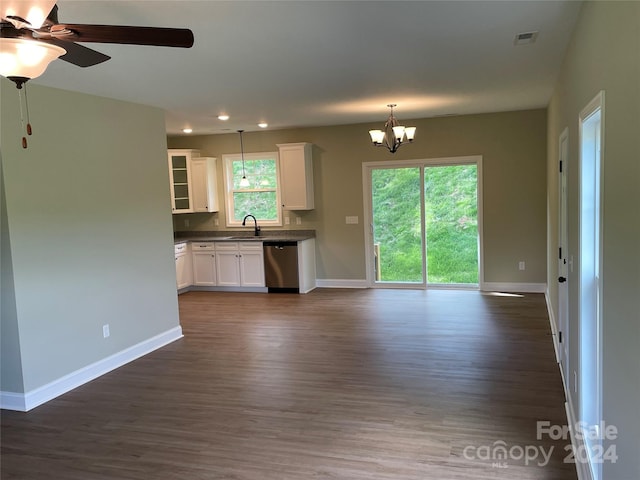 unfurnished living room featuring ceiling fan with notable chandelier, dark hardwood / wood-style flooring, and sink