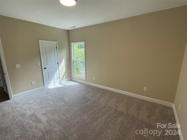 empty room featuring carpet flooring