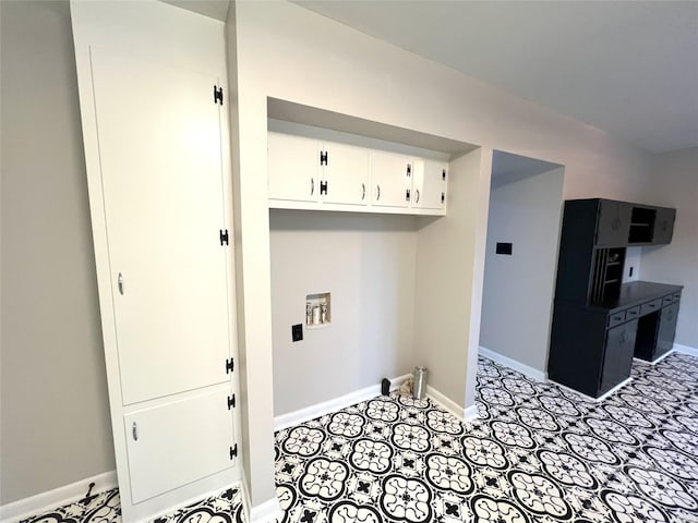 laundry room with light tile floors, cabinets, and hookup for a washing machine