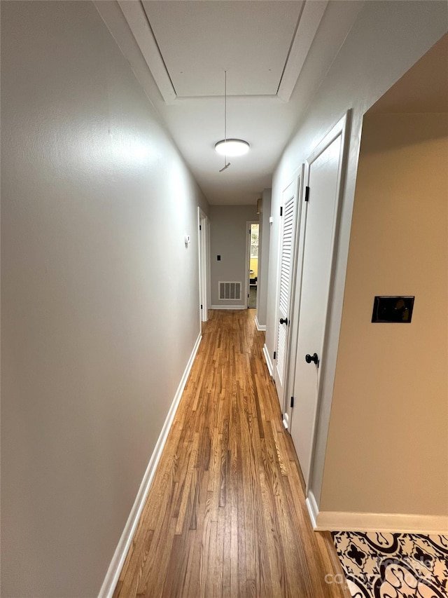 corridor featuring light wood-type flooring