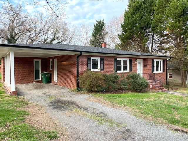 single story home with a carport