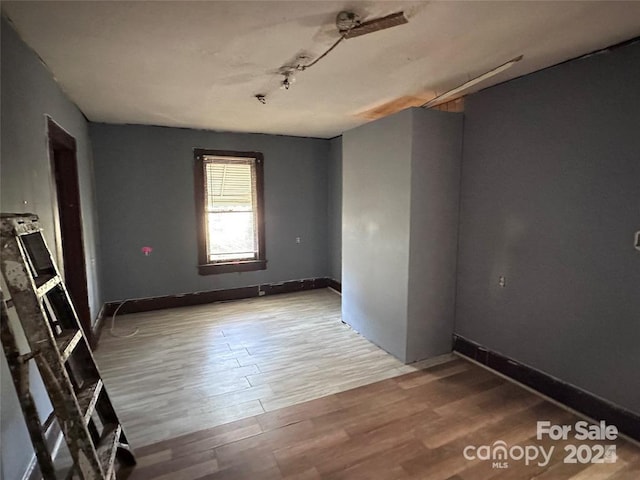 unfurnished room featuring light hardwood / wood-style floors