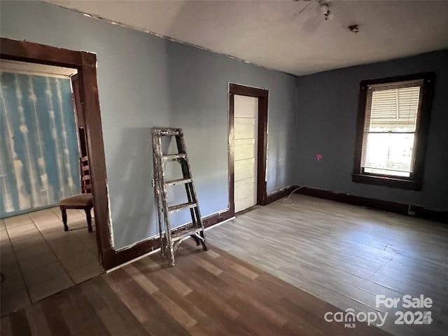 unfurnished room featuring hardwood / wood-style flooring