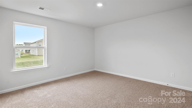 spare room featuring carpet flooring