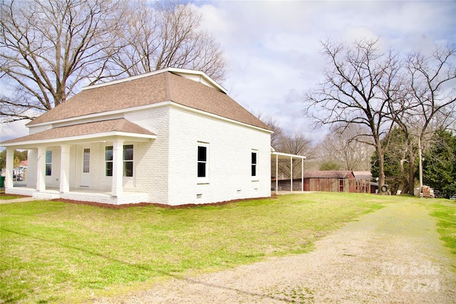 view of home's exterior with a yard