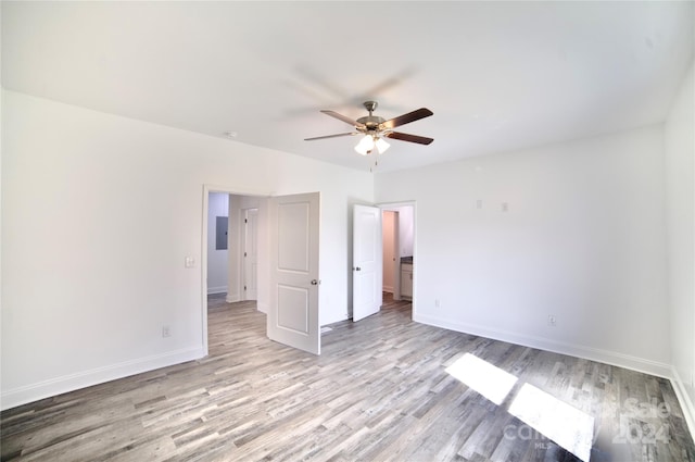 spare room with light hardwood / wood-style floors and ceiling fan