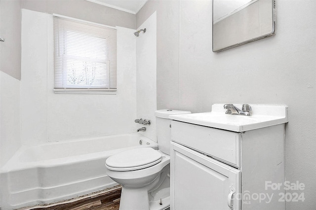 full bathroom featuring wood-type flooring, shower / bathing tub combination, vanity, and toilet