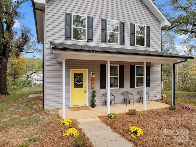 view of front property featuring a porch