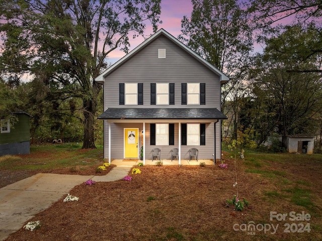 traditional-style home featuring a porch