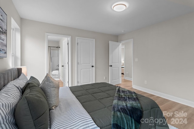 bedroom with light hardwood / wood-style flooring