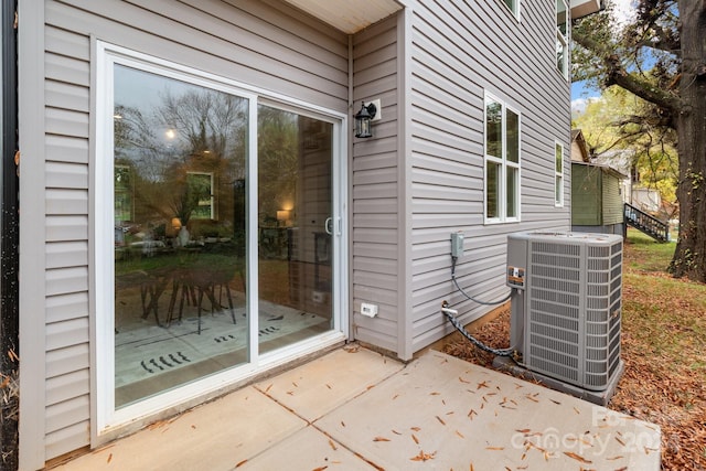 exterior space featuring central AC unit and a patio