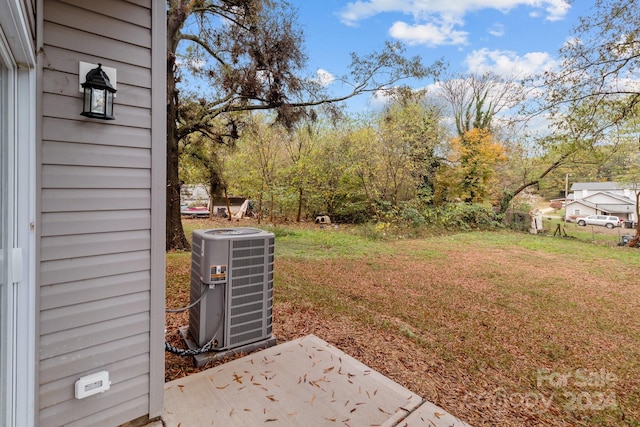 view of yard featuring central air condition unit