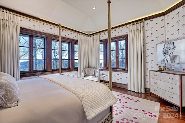 bedroom with dark wood-type flooring and vaulted ceiling