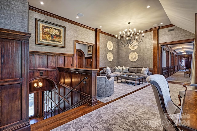 interior space featuring crown molding, vaulted ceiling, and a chandelier