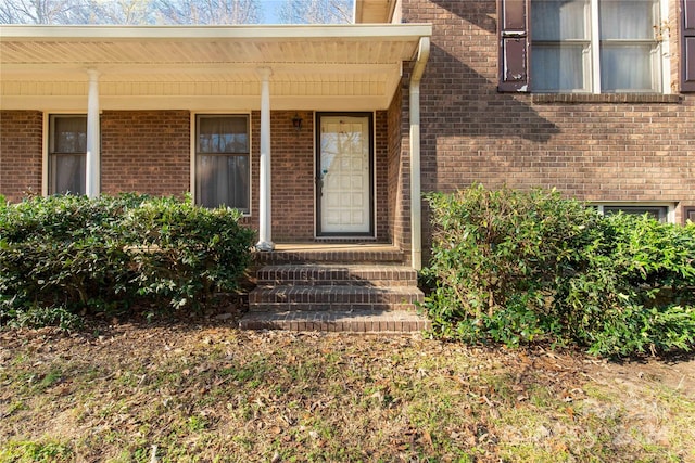 property entrance featuring a porch